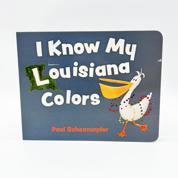 A children's board book titled 'I Know My Louisiana Colors' by Paul Schetzmayder, featuring a dark slate blue cover with a colorful illustrated white bird and a green state-shaped word.