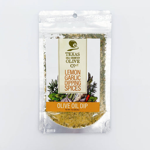 Packaged lemon garlic dipping spices with Texas Hill Country Olive Co branding on a light gray background