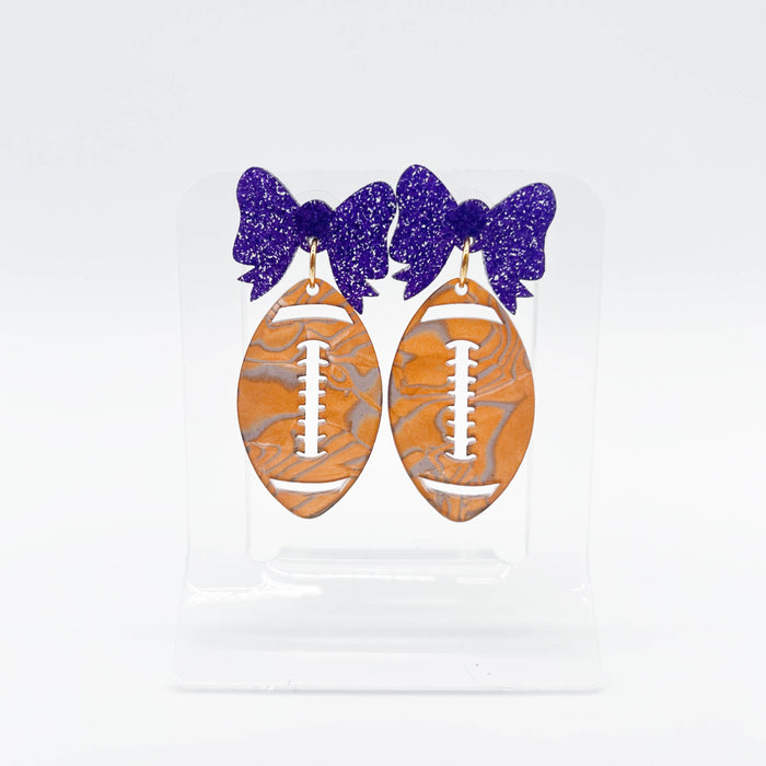 Sandy and Rizzo Fancy Football Dangle Earrings Purple Bow Handpainted One of a kind Art LSU 