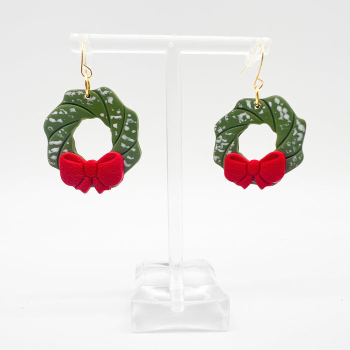 Christmas bow wreath clay earrings lightweight green with light powdered snow and bright red bow